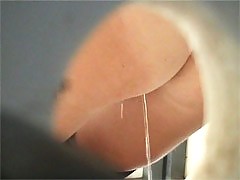 Tanned honeys tinkling right above a voyeur camera