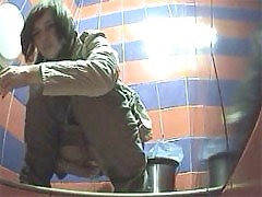 Voyeur films girls pissing in public toilet